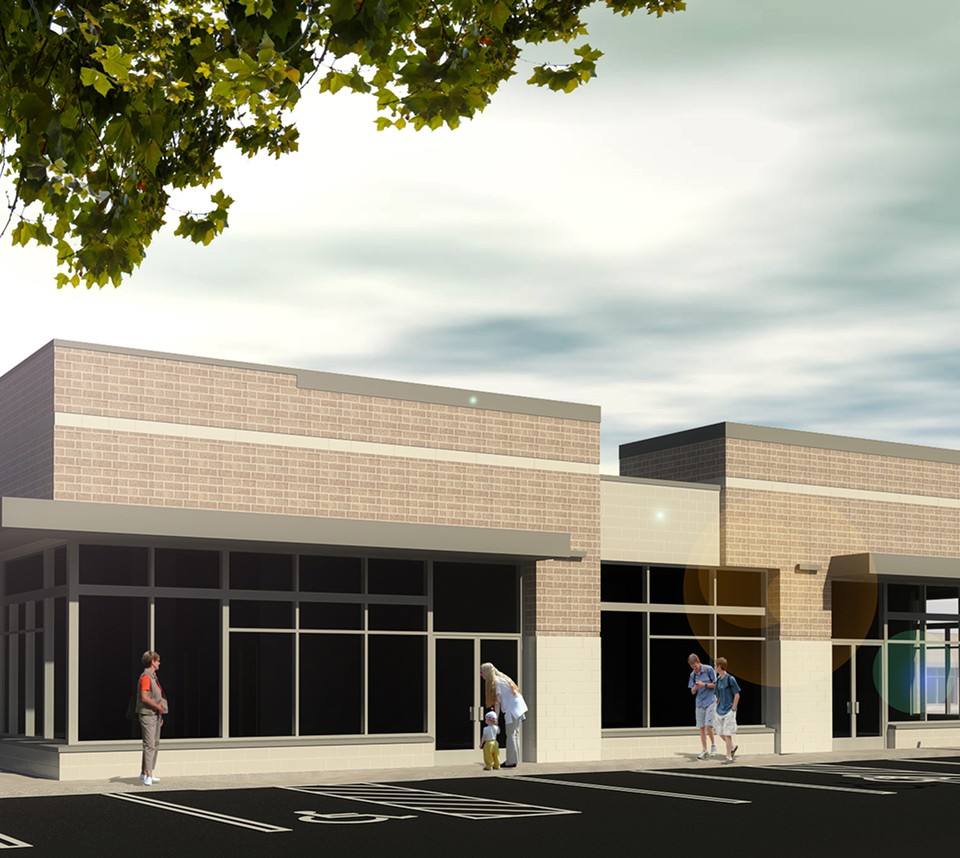 Modern commercial building with people outside.