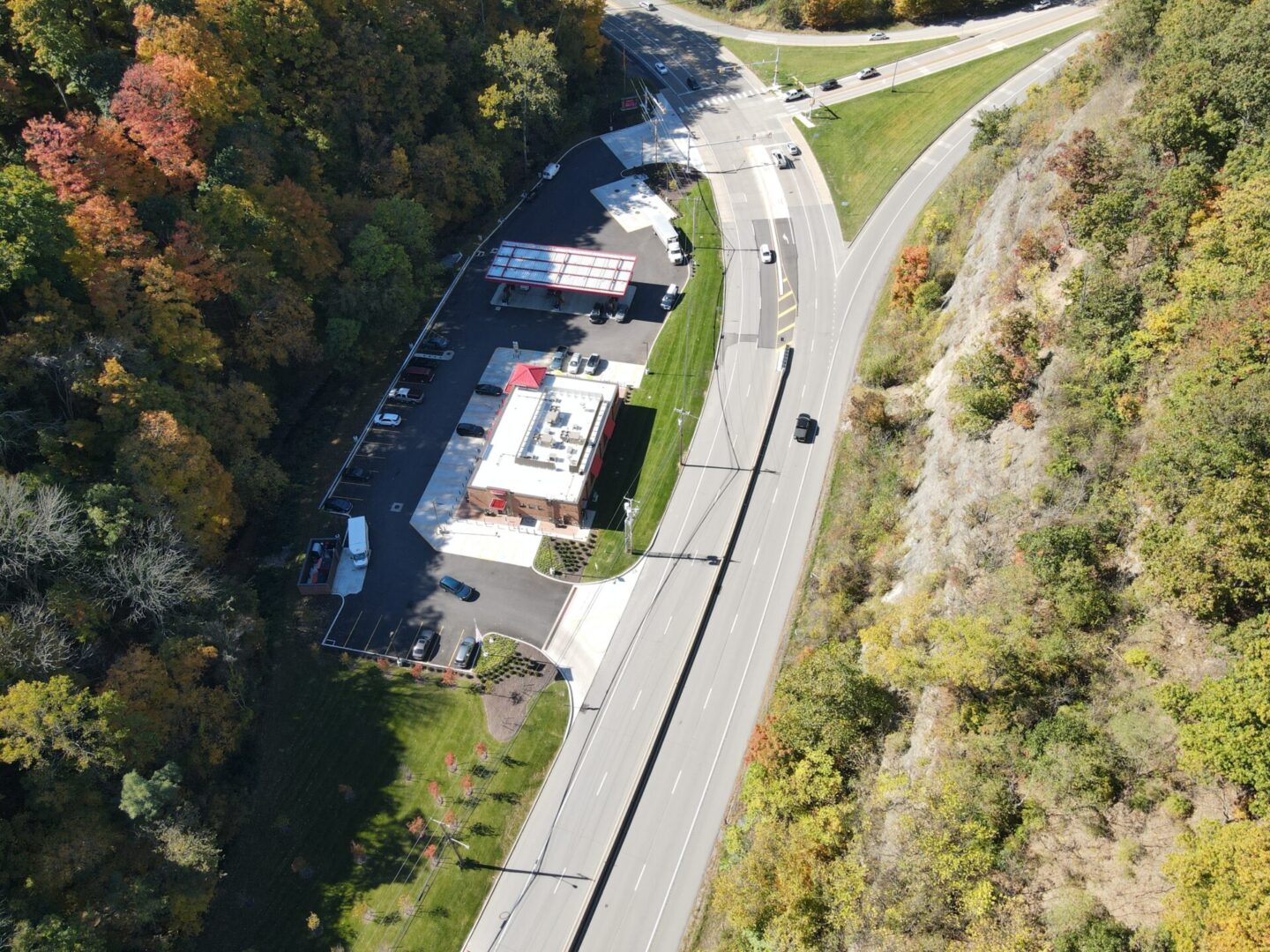 Aerial view of gas station by road.
