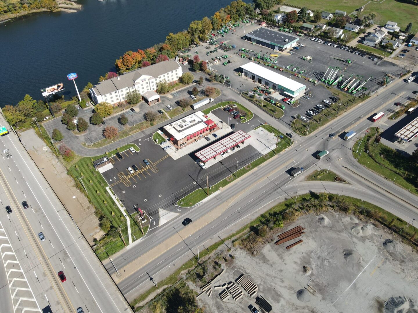 Aerial view of roads, buildings, and river.